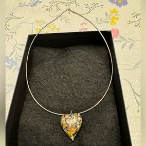 This is a new sterling silver Italian heart glass pendant and a sterling chain.